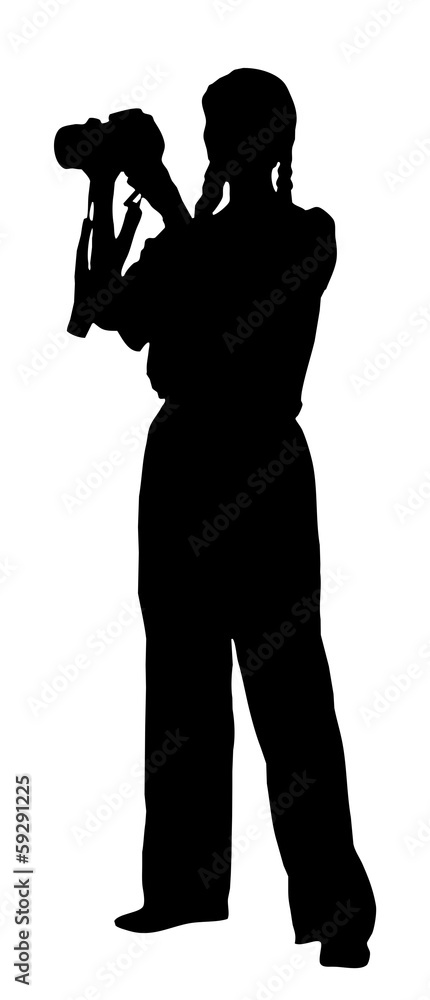 portrait silhouette of a young woman photographer holding a came