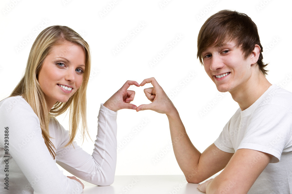 couple showing a heart with their fingers couple showing a heart with their fingers