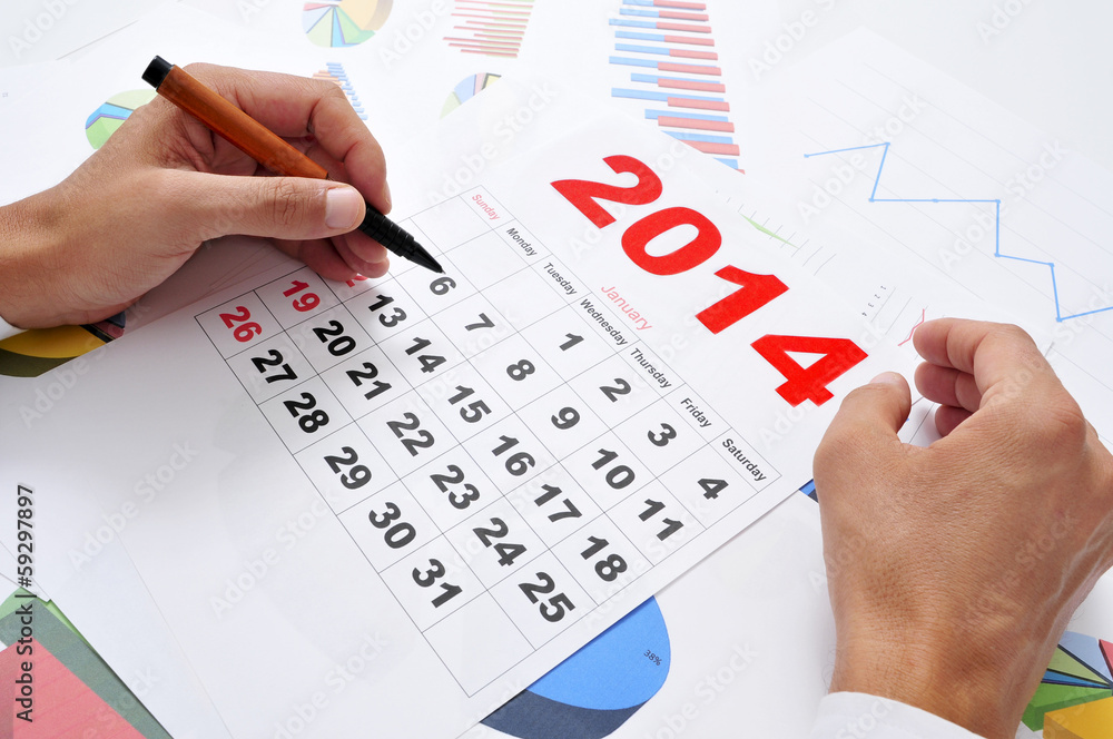 in the office with a 2014 calendar in the office with a 2014 calendar