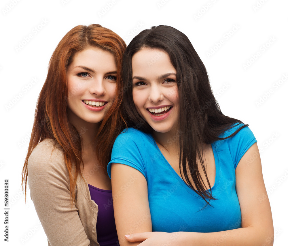 two laughing girls hugging two laughing girls hugging