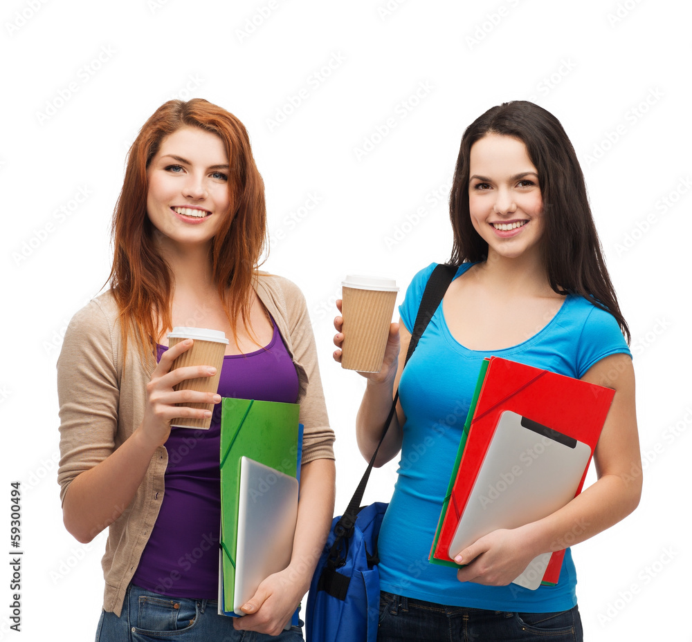 two students with bag, folders, tablet and coffee two students with bag, folders, tablet and coffee