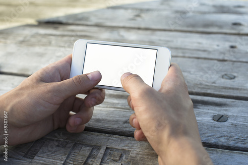 Hand holding Smartphones with Blank Screen