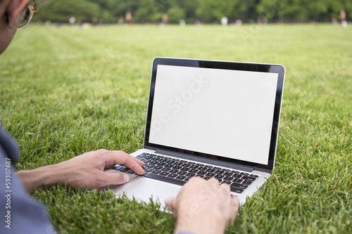 Person working on laptop in park