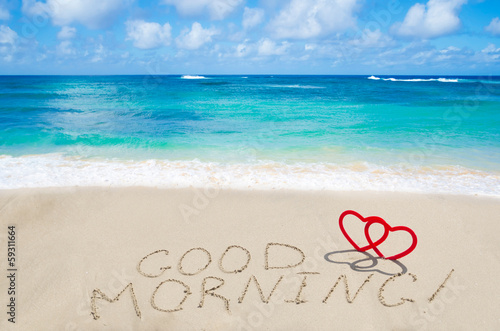 Sign "Good morning" with hearts on the beach