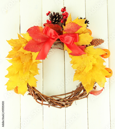 Beautiful Thanksgiving wreath  on white wooden background