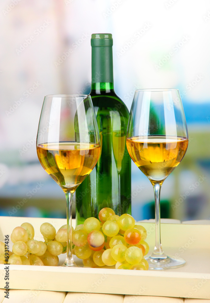 Ripe grapes, bottle and glasses of wine
