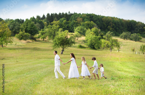 Big family is relaxing in green nature