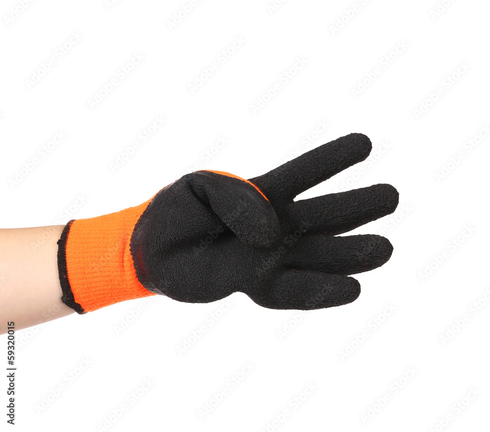 Black rubber glove on hand. Black rubber glove on hand.
