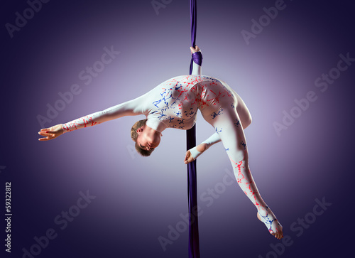 Beautiful dancer on aerial silk, aerial contortion, aerial ribbo