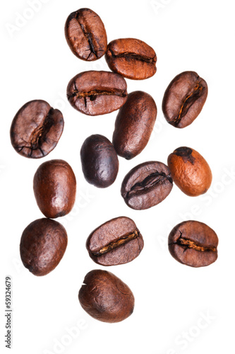 many falling roasted coffee beans