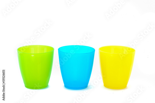 Plastic cups of various color isolated on white