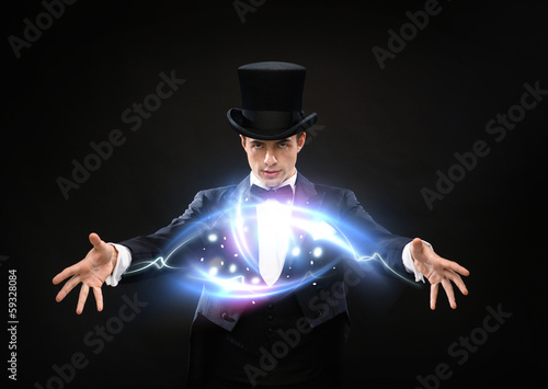 magician in top hat showing trick
