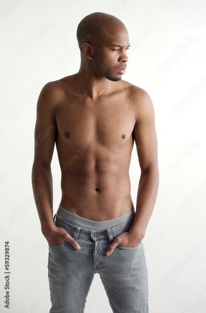 Good looking young man standing on white background