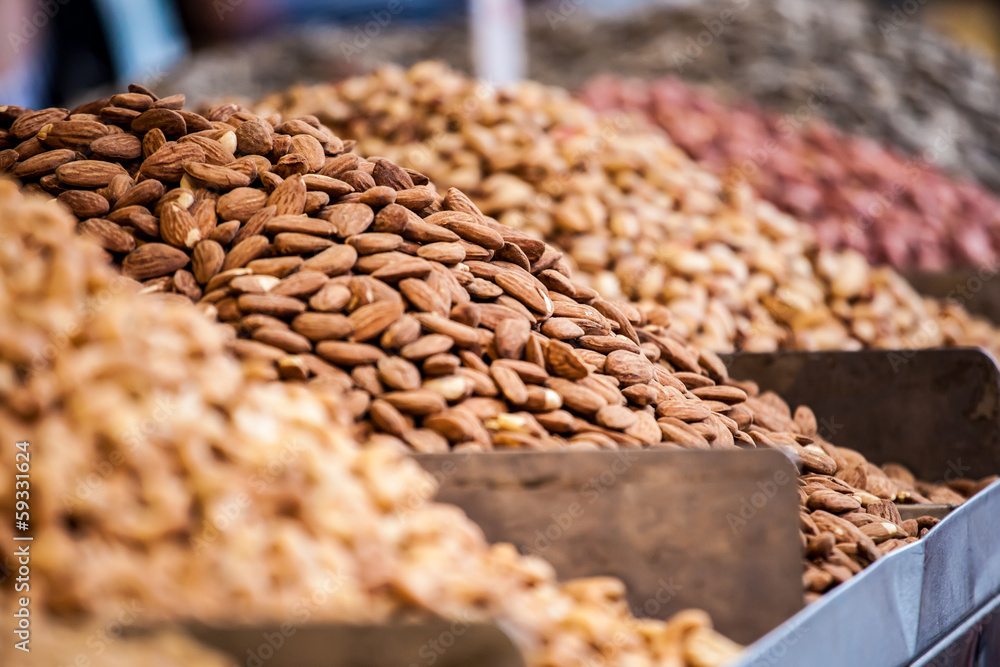 Obraz premium Assortment of nuts and almonds on market stand in Israel