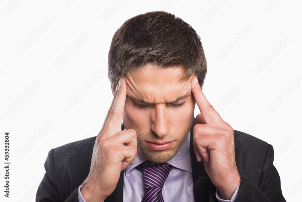 Tensed businessman suffering from headache Tensed businessman suffering from headache