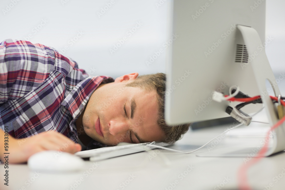 Handsome student dozing in the computer room Handsome student dozing in the computer room