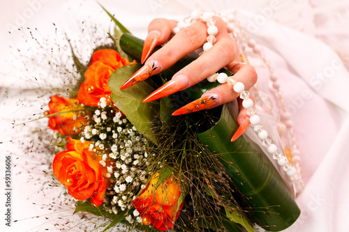 Long orange artificial bridal nails