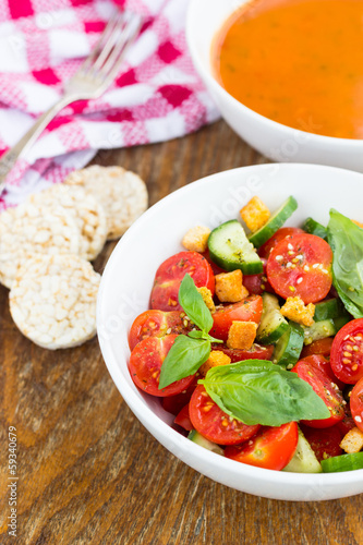 Tomato salad with cucumber and croutons