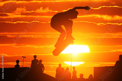 Jumping extreme high skateboard skater boy