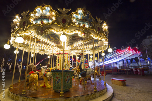Luna park carousel in a public outdoor area © ververidis