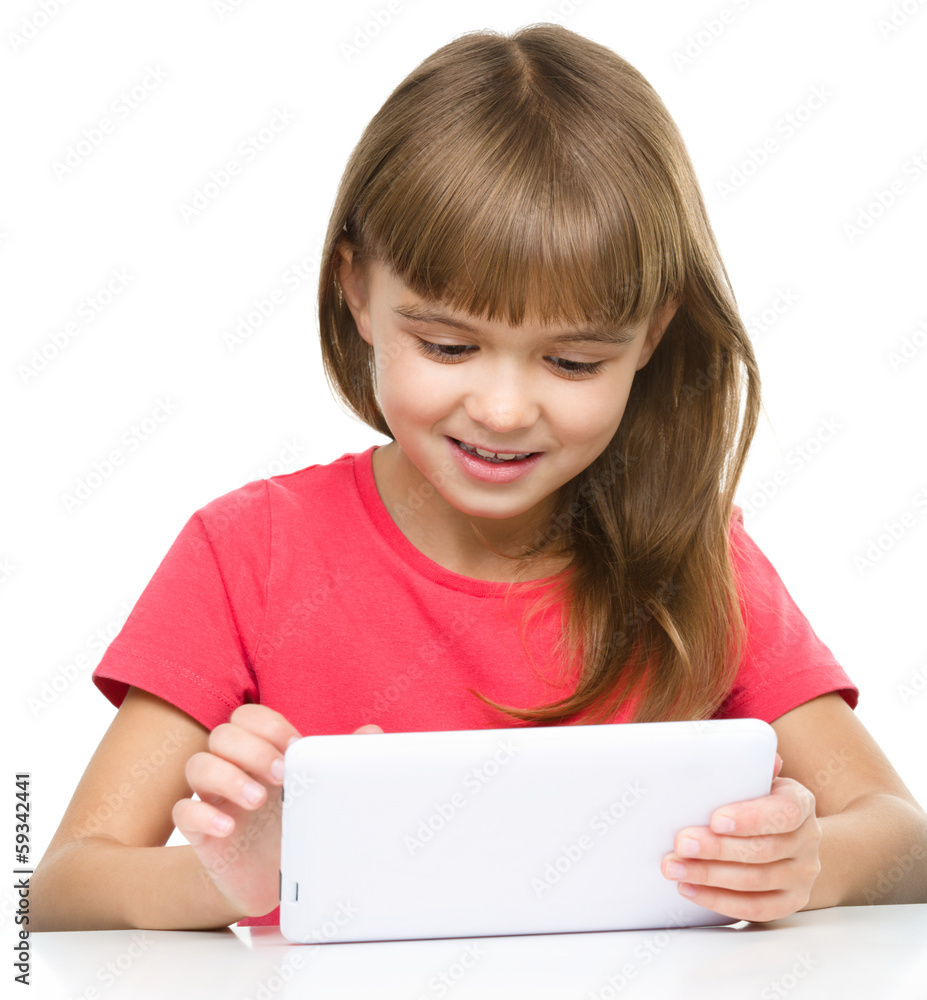 Young girl is using tablet Young girl is using tablet