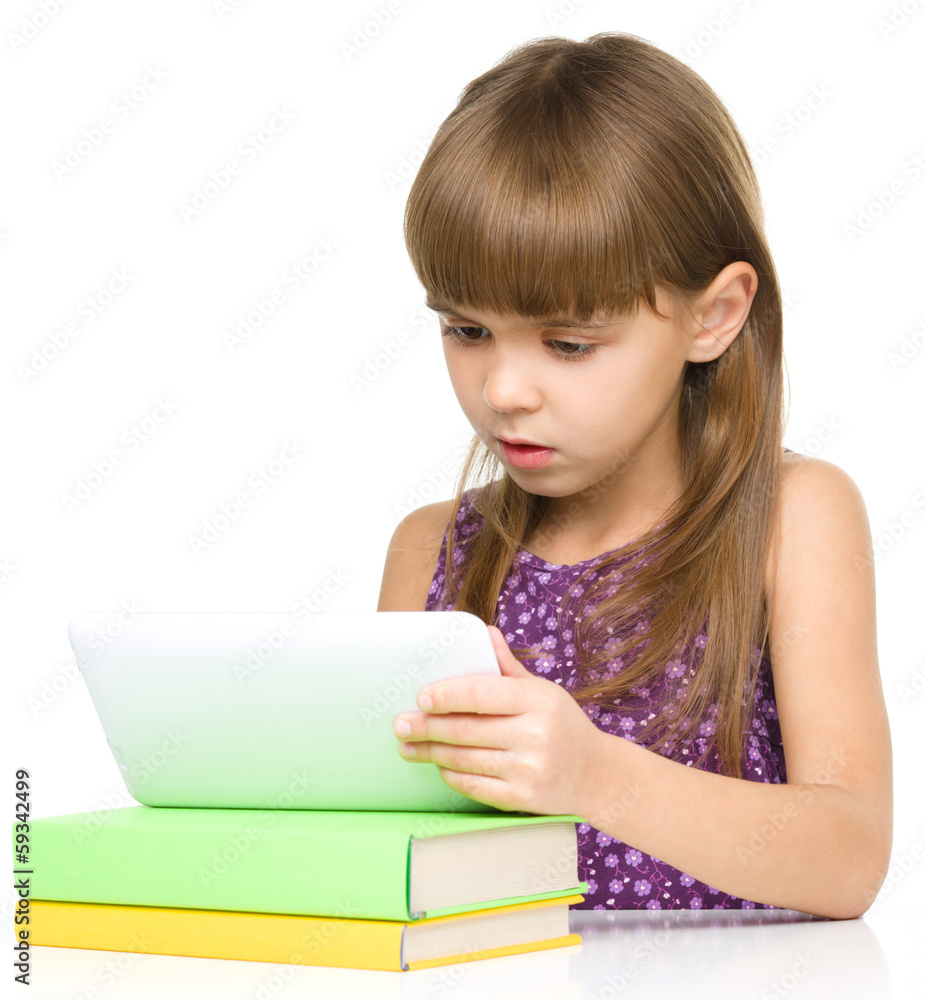 Young girl is using tablet Young girl is using tablet