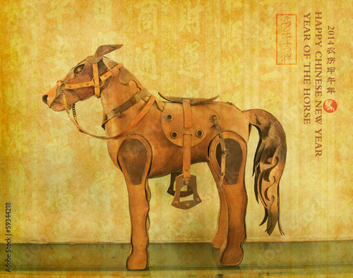Foto Leather horse souvenir on old paper