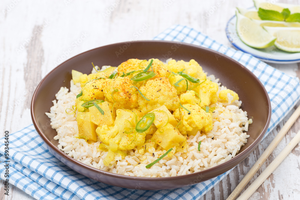 Thai food - vegetable curry with cauliflower and rice on plate Thai food - vegetable curry with cauliflower and rice on plate