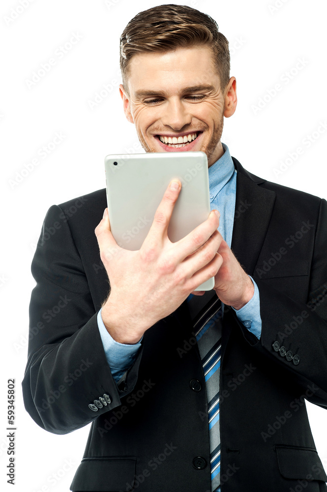 Businessman operating tablet device Businessman operating tablet device