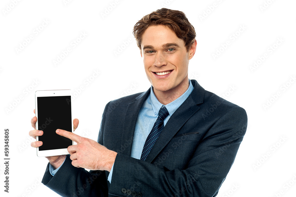 Businessman promoting newly launched tablet Businessman promoting newly launched tablet