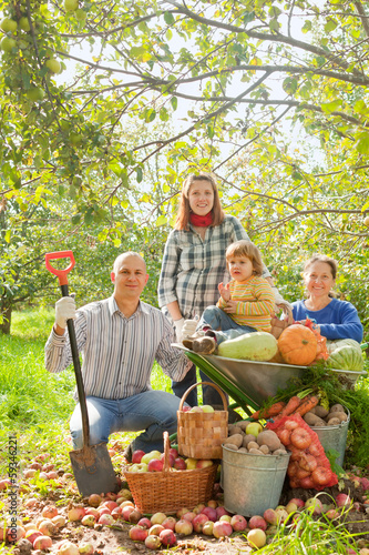 Happy family with in vegetable garden