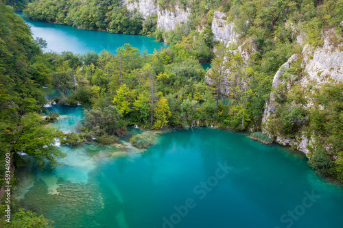 Two big lakes seperated with small waterfalls in Plitvice Lakes