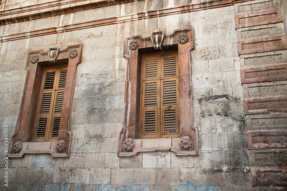 Two old windows closed by shutters, Jerusalem Two old windows closed by shutters, Jerusalem