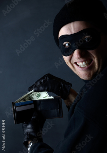 Thief stealing