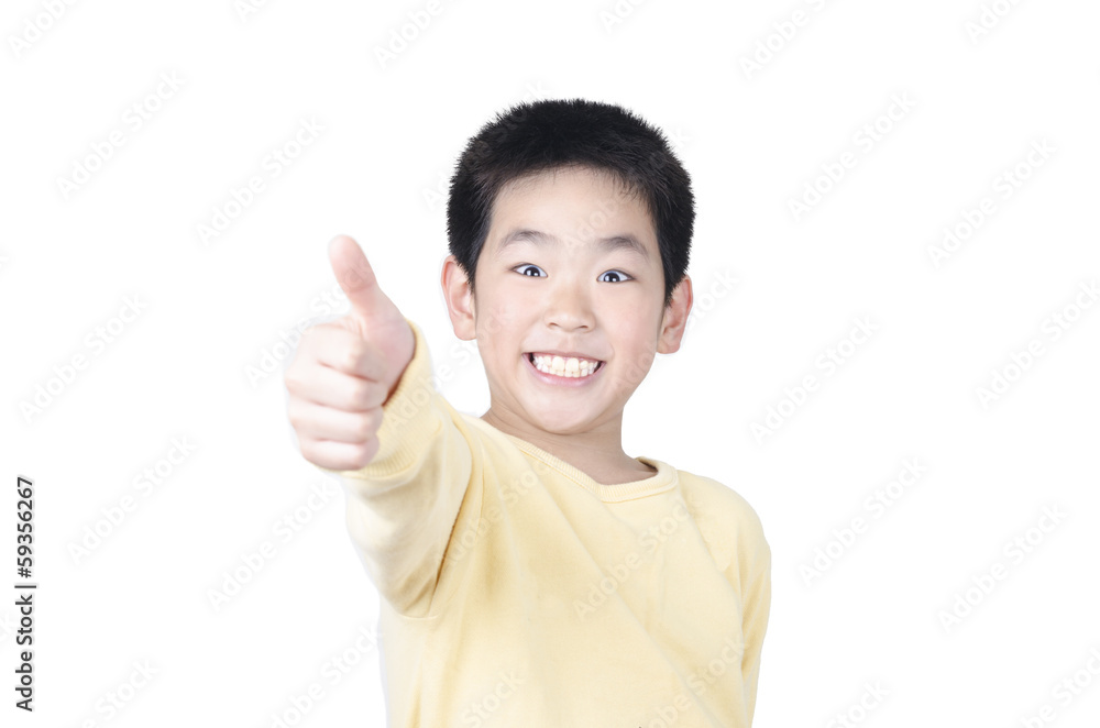 Joyful little boy holding his thumb up Joyful little boy holding his thumb up
