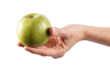 Female hand holds a green apple
