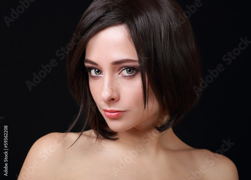 Beautiful sexy woman with green eyes and short hair looking