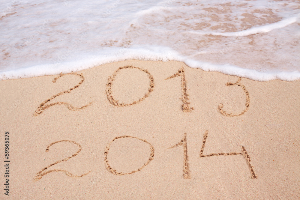 Fototapeta premium Year 2014 written in sand on tropical beach .