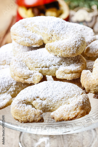 Stack of christmas croissants on glass cake stand