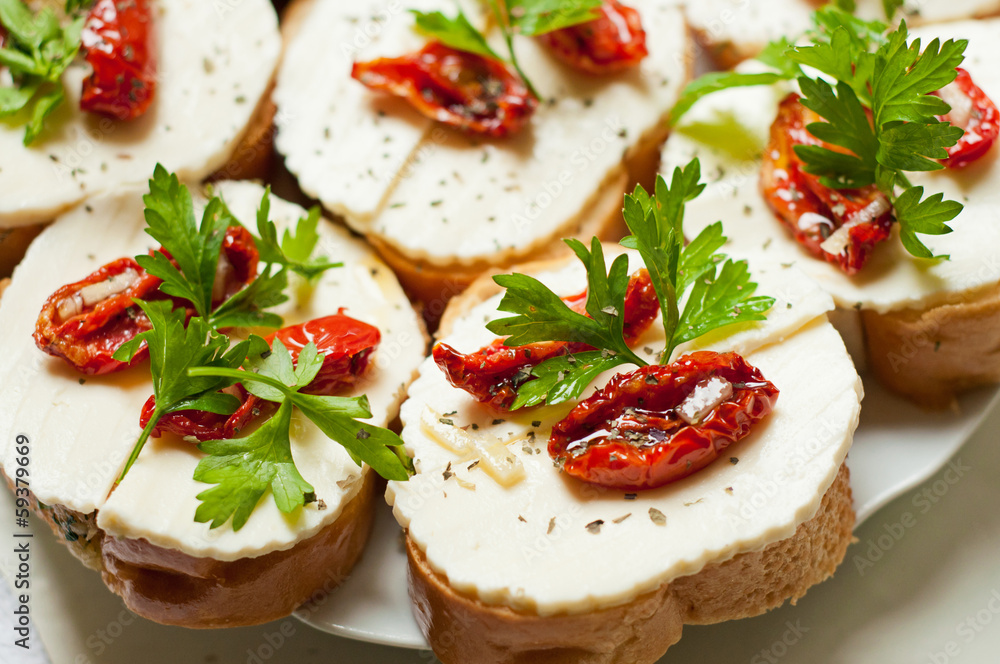 Bruschetta with sun dried tomatoes and mozzarella Bruschetta with sun dried tomatoes and mozzarella