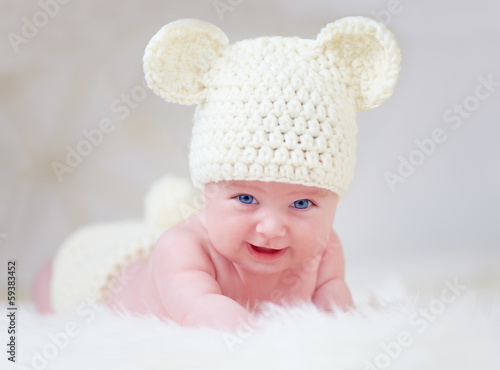 beautiful smiling baby in cute hat