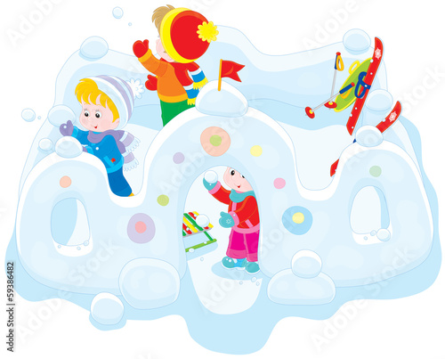Children playing snowballs in a snow fortress