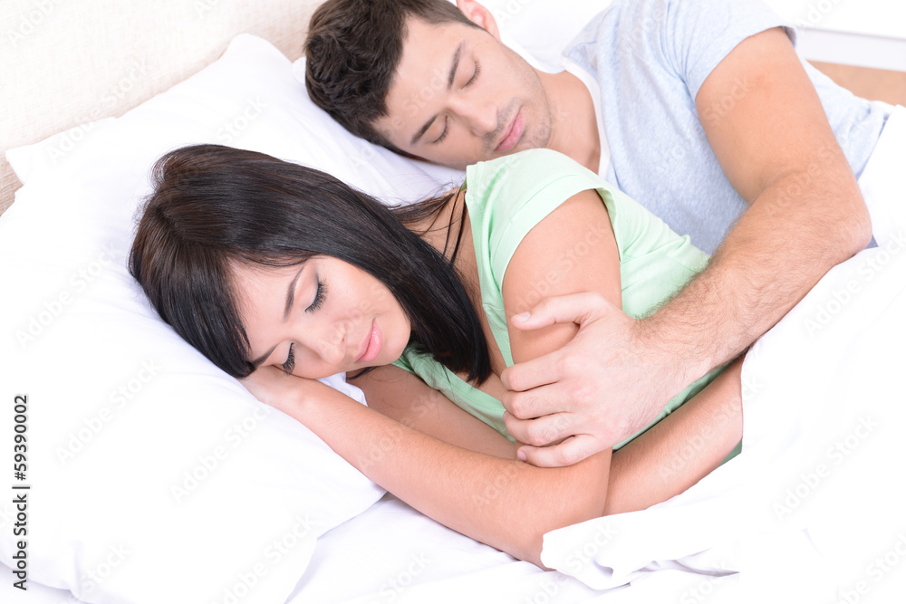 Couple in love sleeping in bed Couple in love sleeping in bed