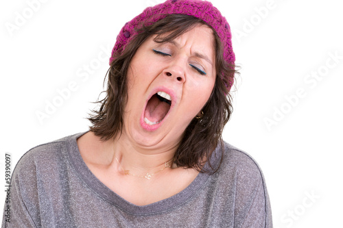 Exhausted or bored woman yawning