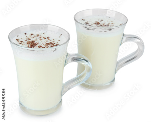 Cups of eggnog isolated on white