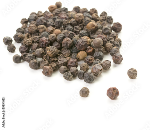 Whole peppercorn scattering on white background.