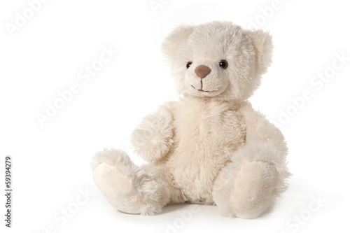 Fluffy teddy bear isolated on white photo
