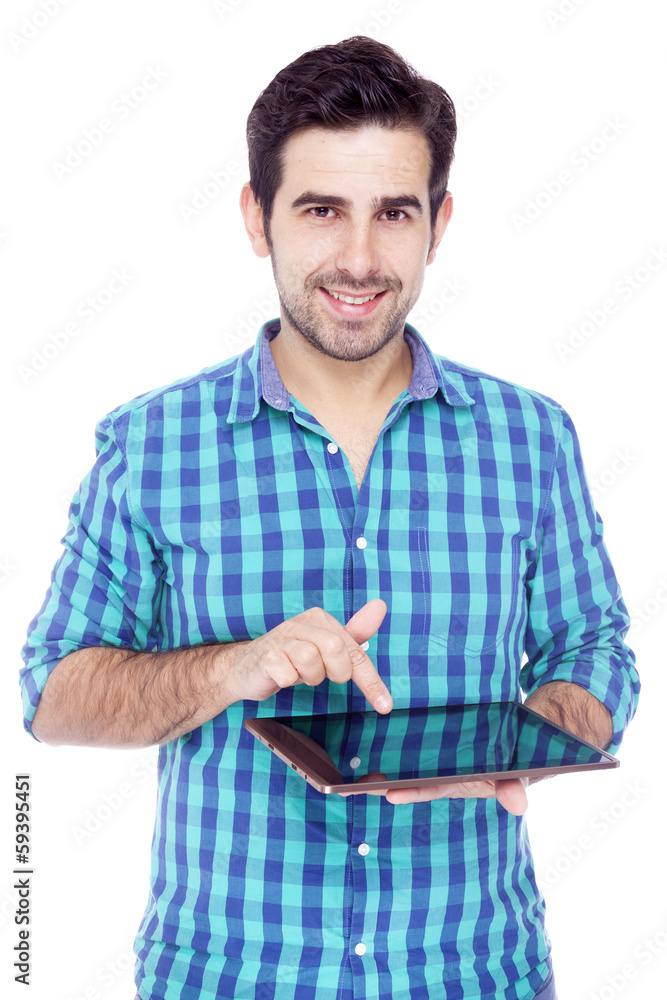 Handsome smiling man using a tablet computer, isolated over a wh Handsome smiling man using a tablet computer, isolated over a wh