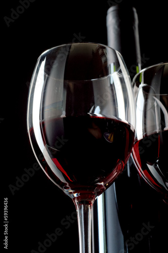 Red wine on black background