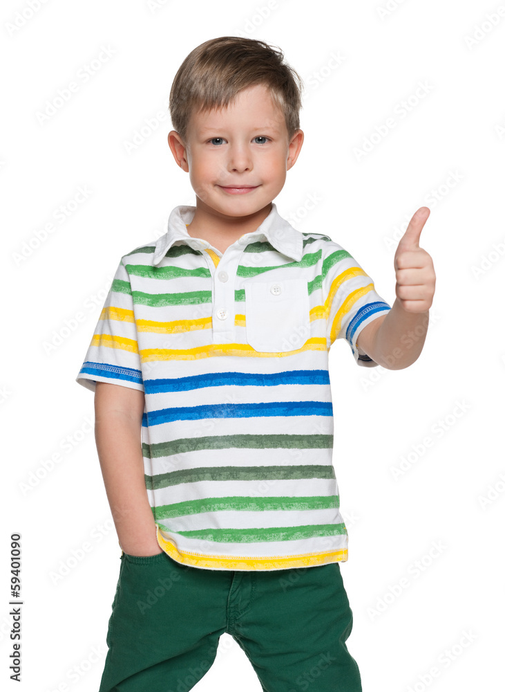 Smiling boy holds his thumb up Smiling boy holds his thumb up